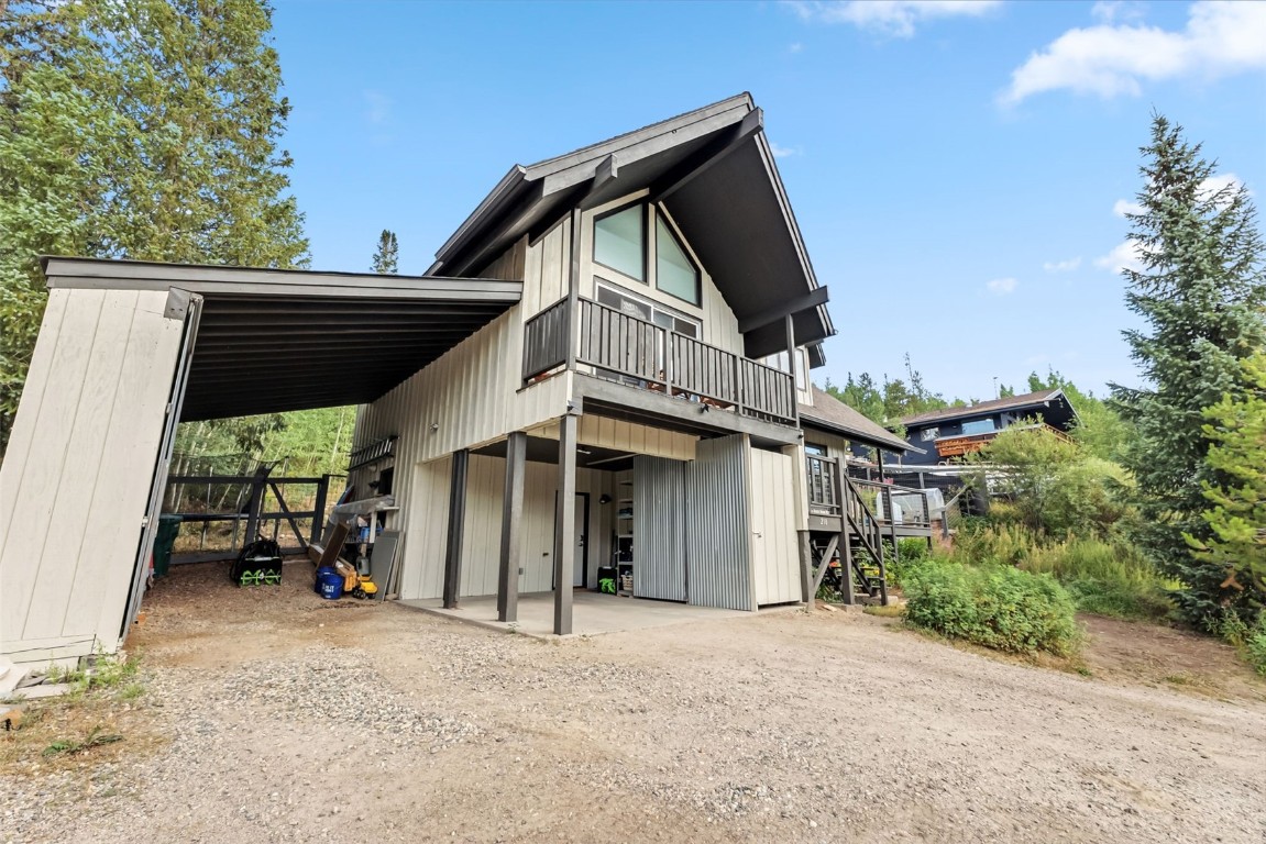 218 Deer Path Road Dillon, CO 80435 - Photo 43 of 49 a view of a house with a wooden deck and a yard