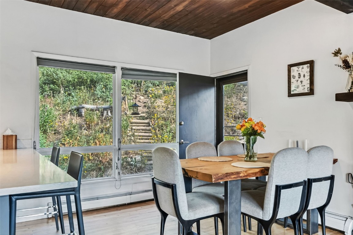 218 Deer Path Road Dillon, CO 80435 - Photo 9 of 49 a view of a dining room with furniture window and wooden floor