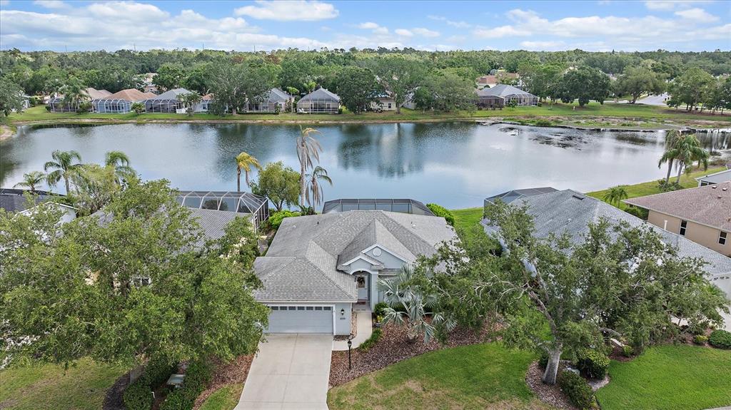 6552 Meandering Way Lakewood Ranch, FL 34202 - Photo 1 of 1 an aerial view of a house with a lake view