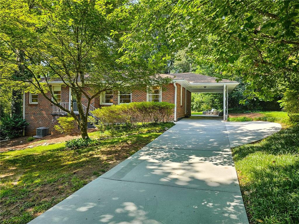 983 North Hills Drive Decatur, GA 30033 - Photo 1 of 1 a backyard of a house with yard and outdoor seating
