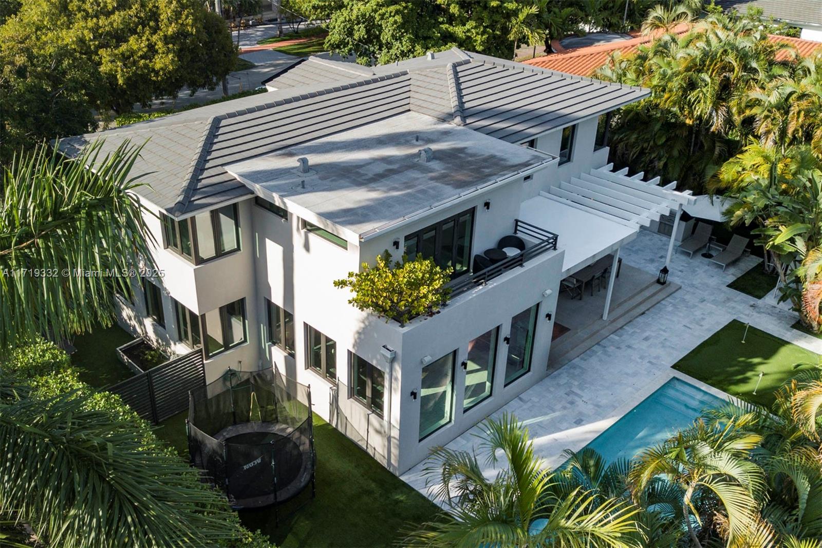 4301 Adams Avenue Miami Beach, FL 33140 - Photo 1 of 51 a aerial view of a house with a yard