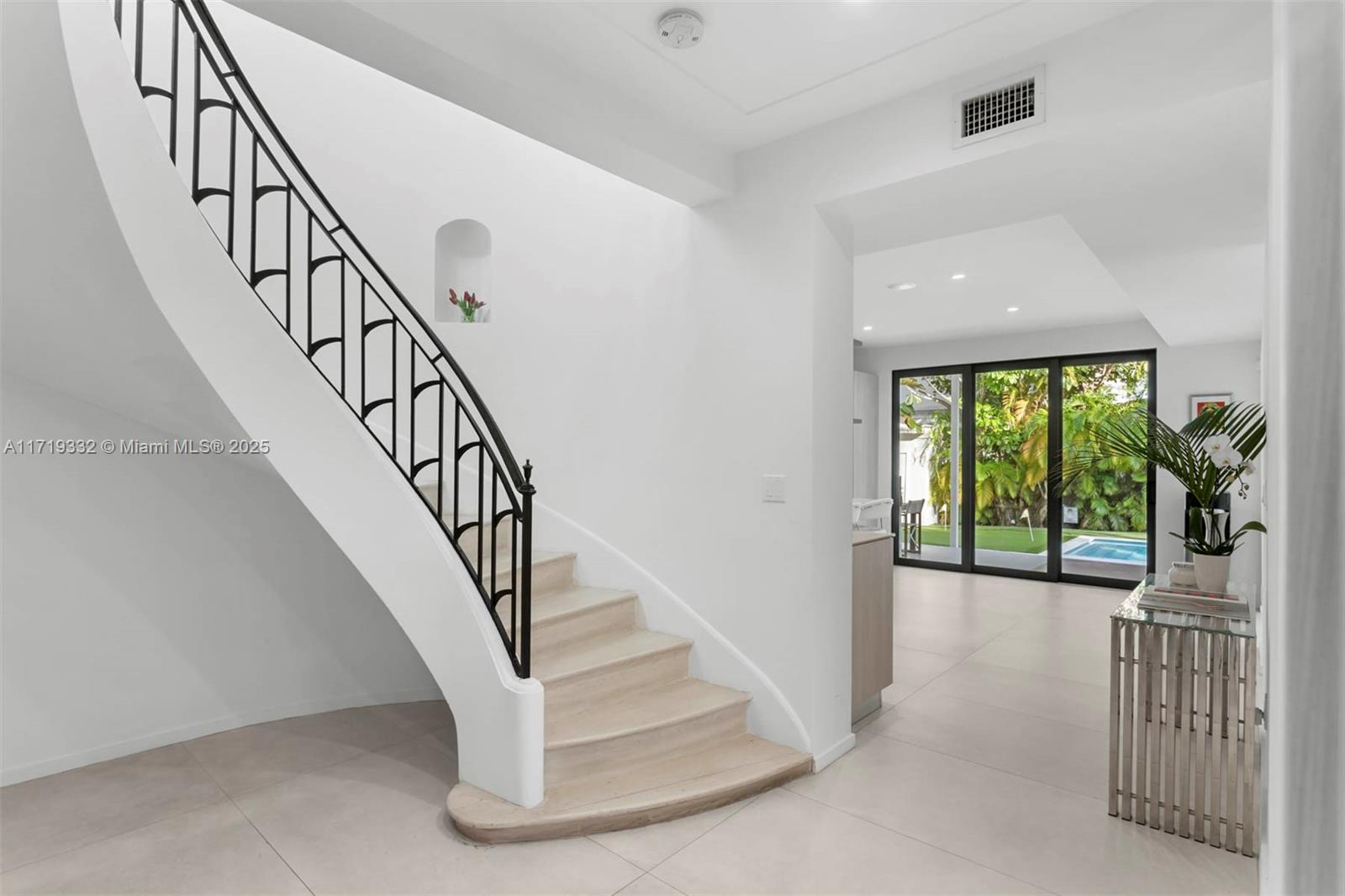 4301 Adams Avenue Miami Beach, FL 33140 - Photo 12 of 51 a view of entryway and hall with wooden floor