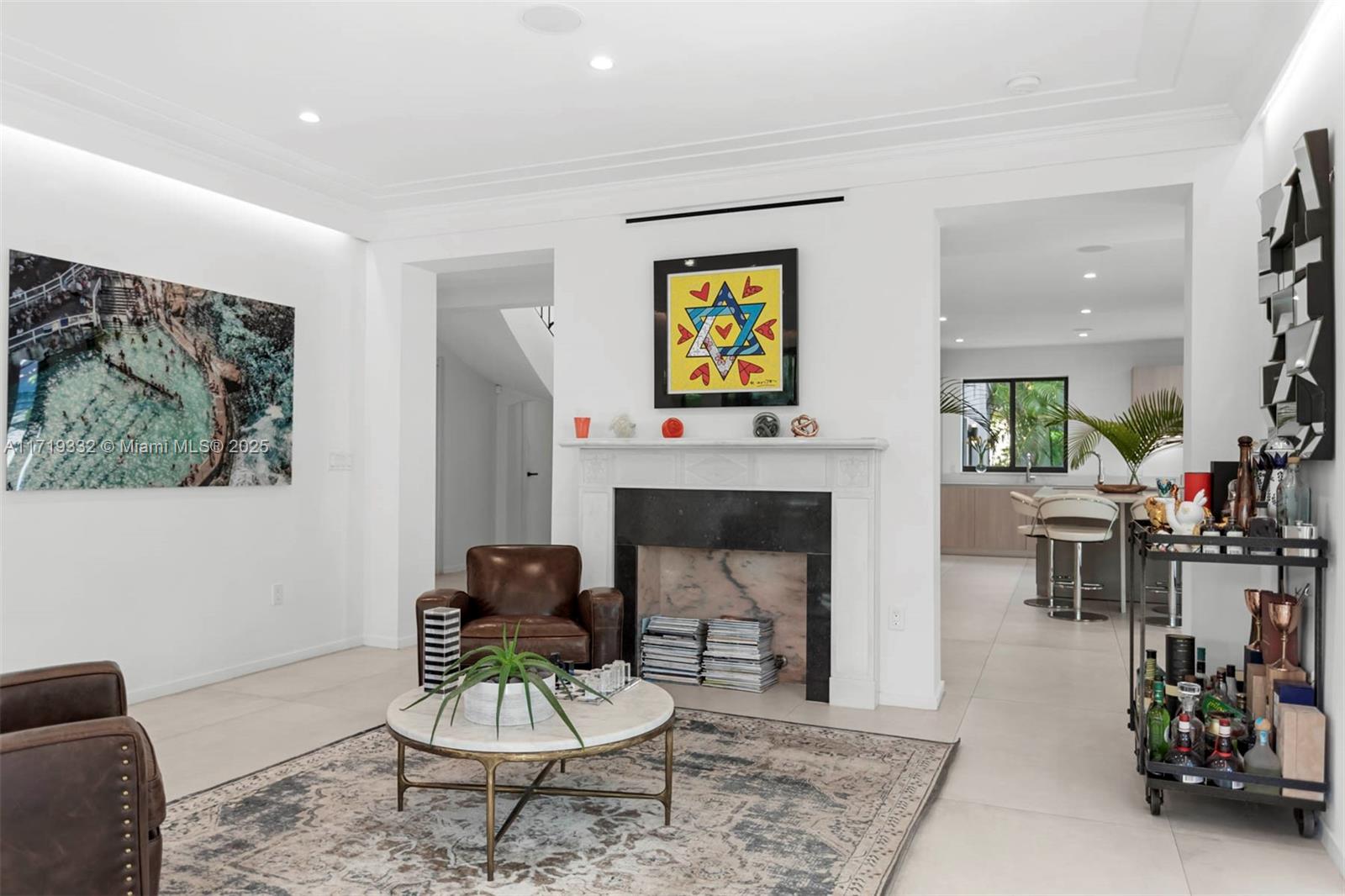 4301 Adams Avenue Miami Beach, FL 33140 - Photo 15 of 51 a living room with furniture and a fireplace