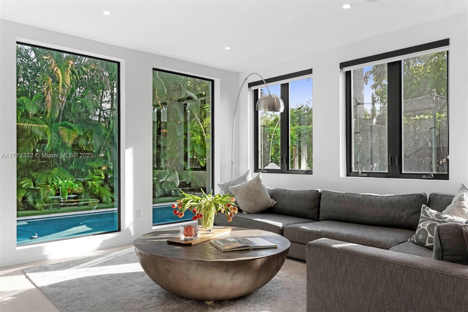 4301 Adams Avenue Miami Beach, FL 33140 - Photo 22 of 51 a living room with furniture and a large window