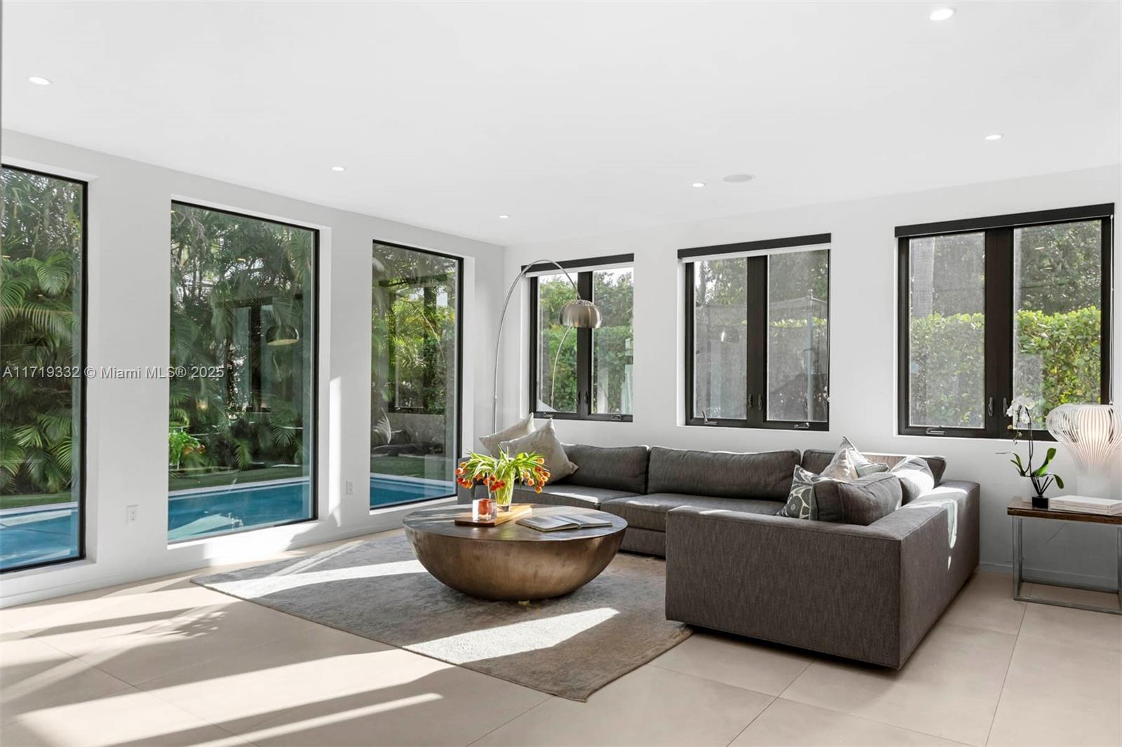 4301 Adams Avenue Miami Beach, FL 33140 - Photo 24 of 51 a living room with furniture and a potted plant