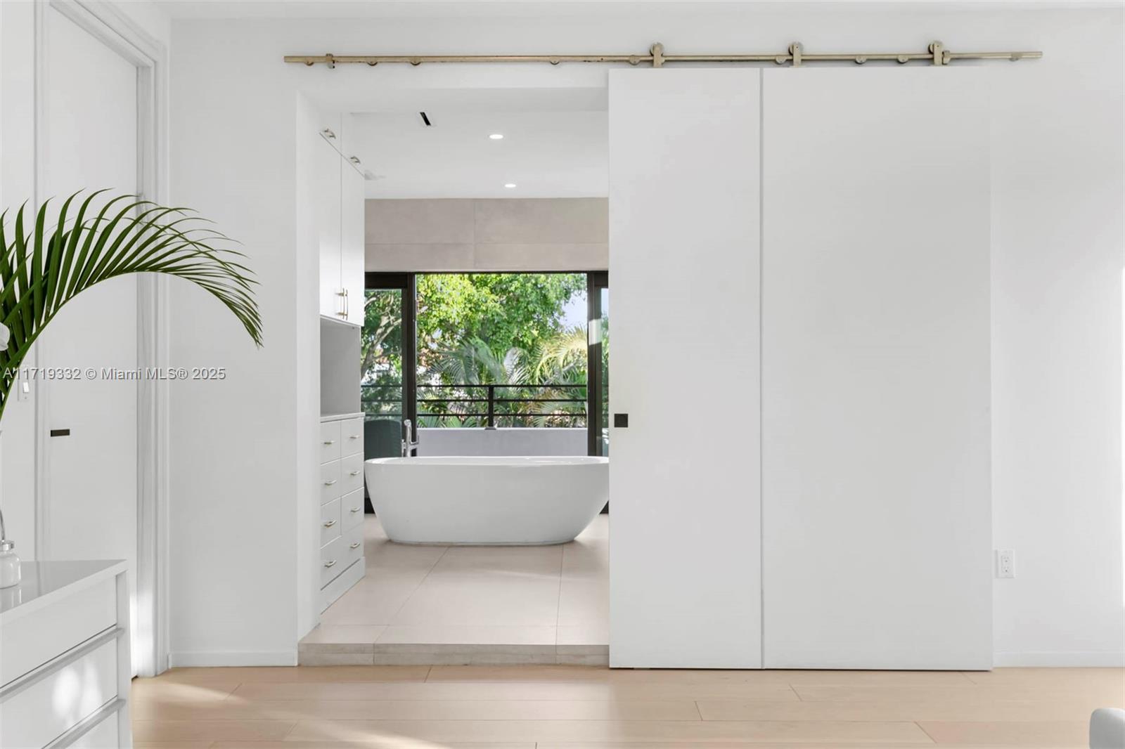 4301 Adams Avenue Miami Beach, FL 33140 - Photo 31 of 51 a bathroom with a bathtub and a window