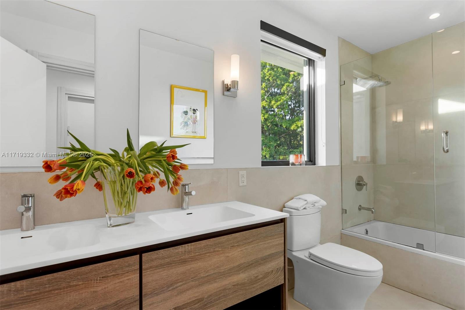 4301 Adams Avenue Miami Beach, FL 33140 - Photo 38 of 51 a bathroom with a sink a toilet a mirror and shower