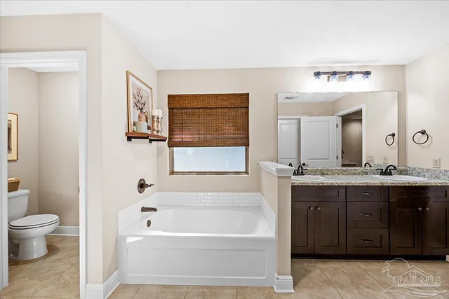 a bathroom with a bathtub sink and toilet
