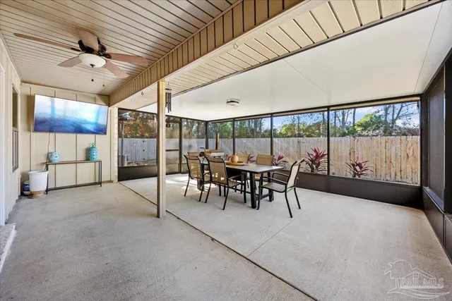 a view of a dining room with furniture window and outside view