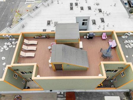an aerial view of a house with a swimming pool