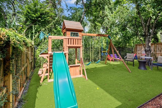 a view of a balcony with wooden floor and outdoor seating