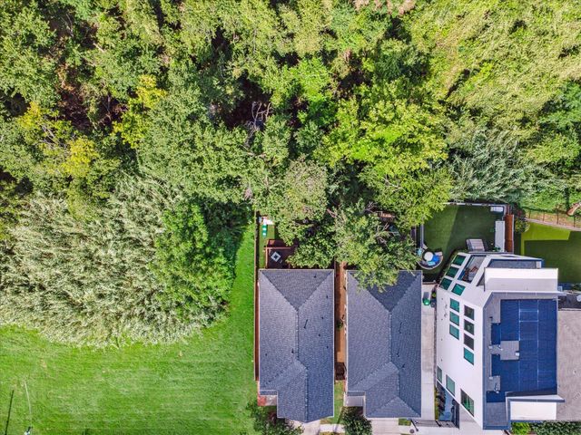 a view of a chairs and table in backyard