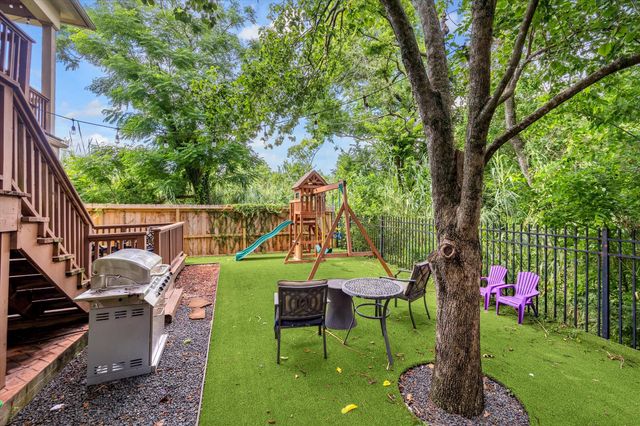 a view of a house with a small yard