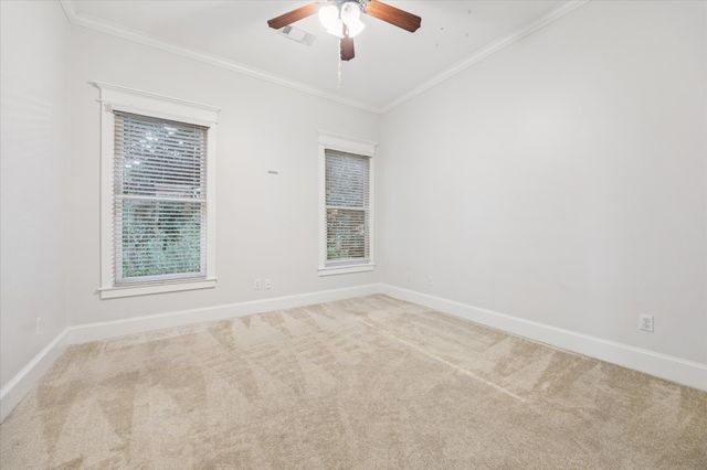a bathroom with a sink a toilet and a large mirror