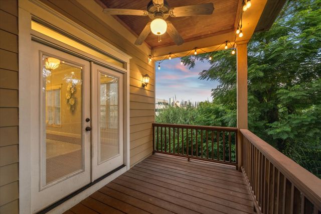 a view of backyard with table and chairs
