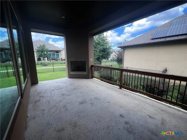 a porch with yard and outdoor seating
