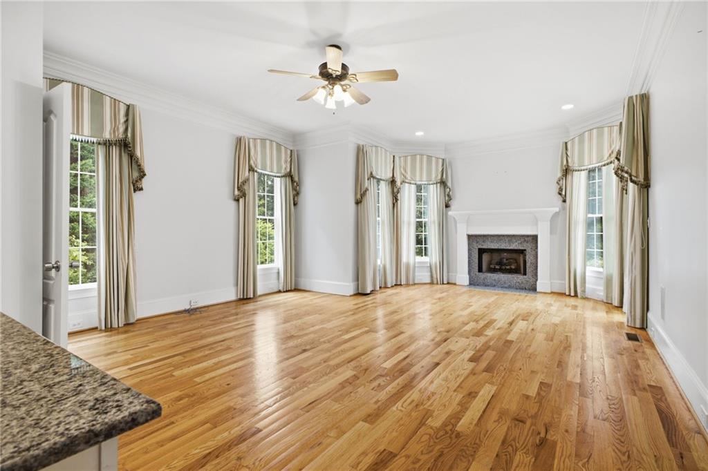 5 St Andrews Way Rome, GA 30165 - Photo 30 of 75 a view of empty room with wooden floor and fireplace