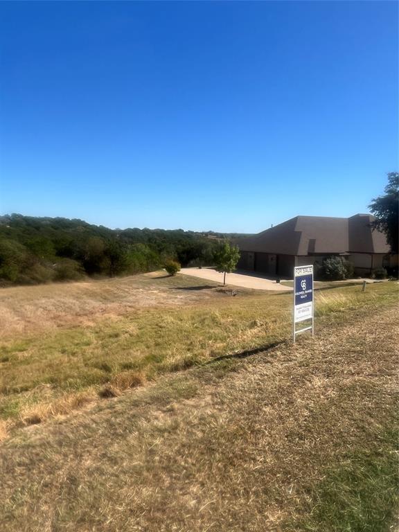 8405 Gullane Street Cleburne, TX 76033 - Photo 10 of 37 a view of lake with sunset