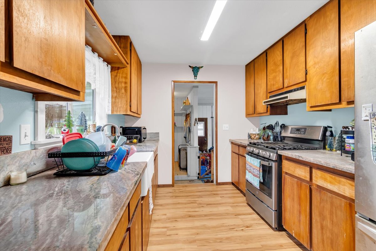 18-4327 North Peck Road Mountain View, HI 96771 - Photo 11 of 30 a kitchen with stainless steel appliances granite countertop a stove a sink and a refrigerator