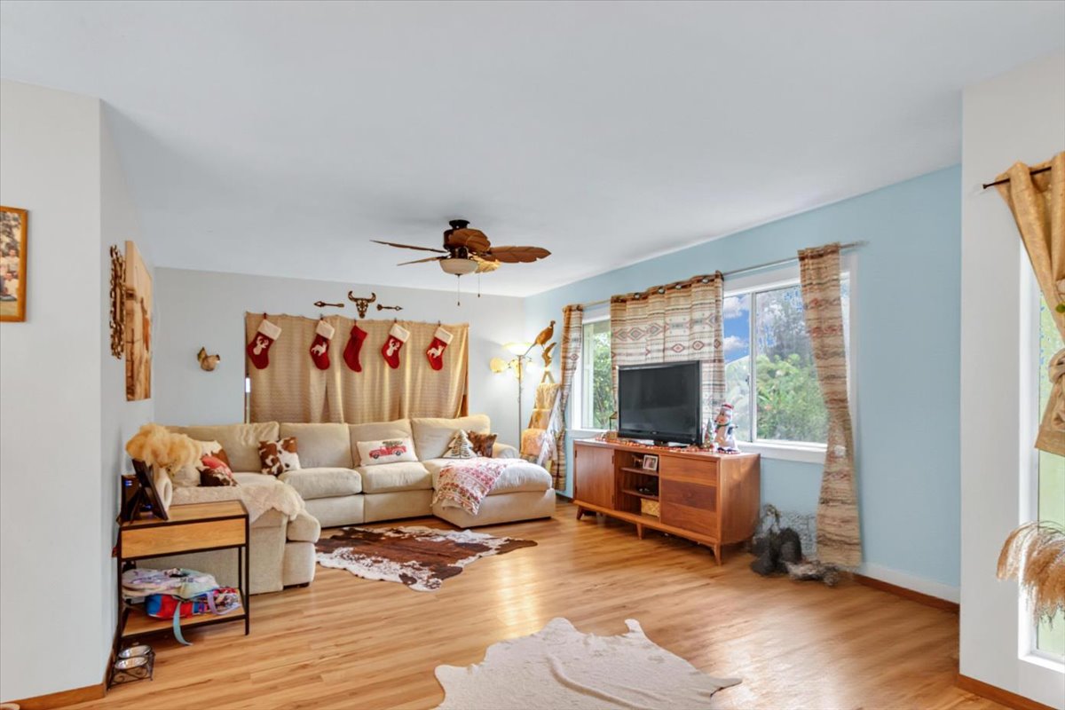 18-4327 North Peck Road Mountain View, HI 96771 - Photo 13 of 26 a living room with furniture and a flat screen tv
