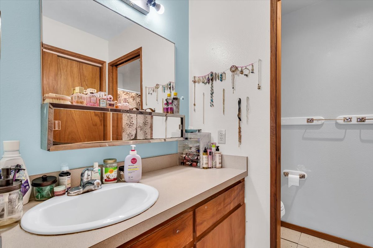 18-4327 North Peck Road Mountain View, HI 96771 - Photo 18 of 30 a bathroom with a sink double vanity and a mirror