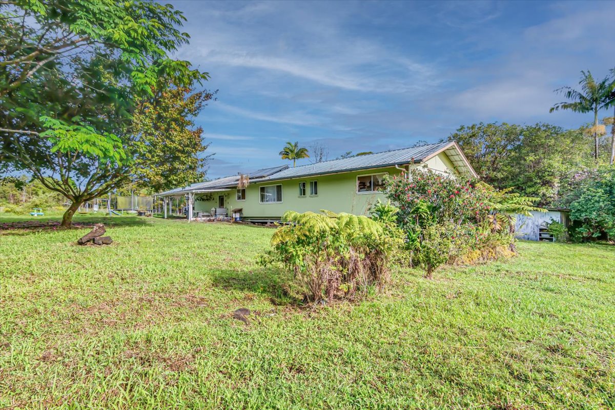 18-4327 North Peck Road Mountain View, HI 96771 - Photo 21 of 26 a front view of a house with a yard
