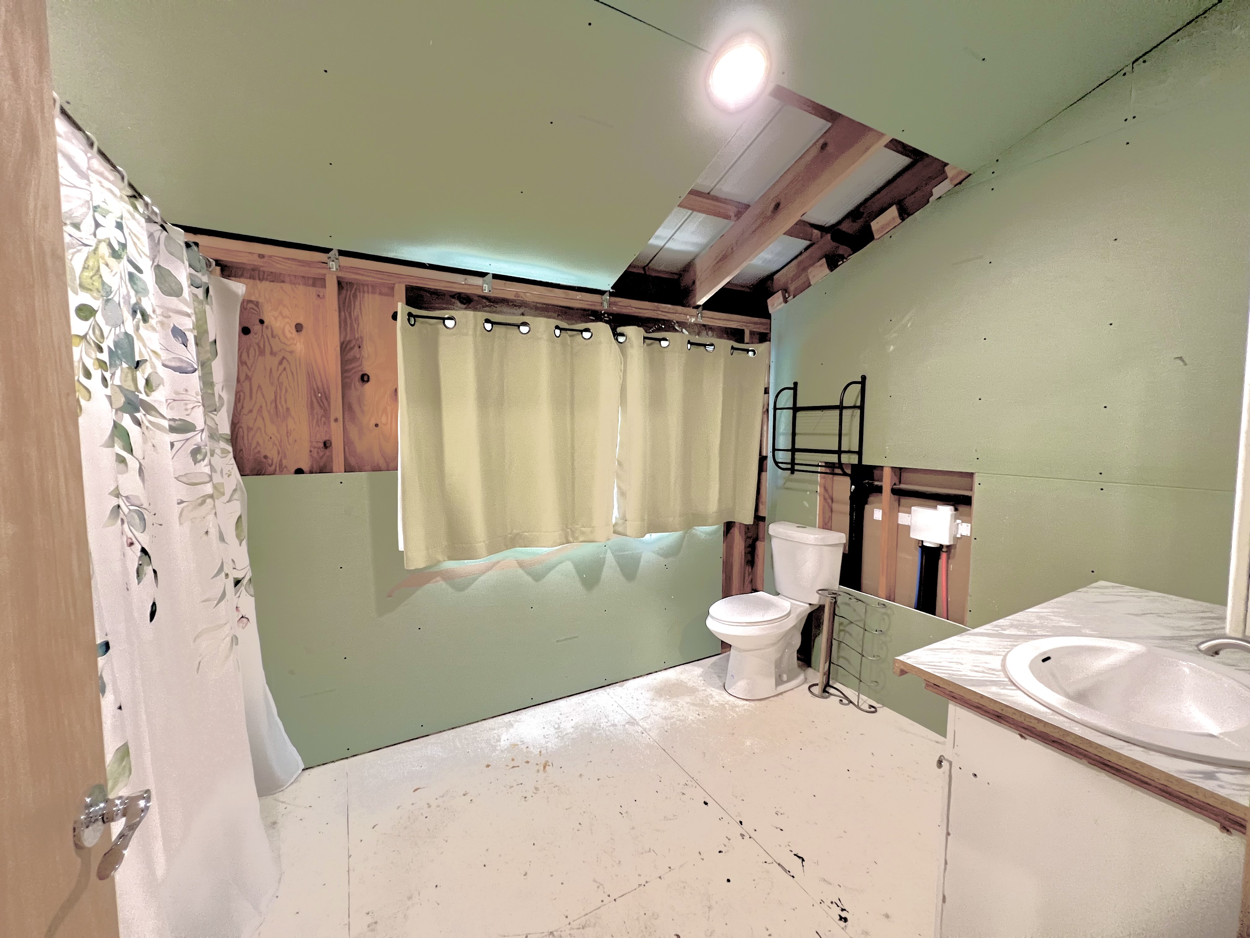 18-4327 North Peck Road Mountain View, HI 96771 - Photo 28 of 30 a bedroom with a bed and a mirror