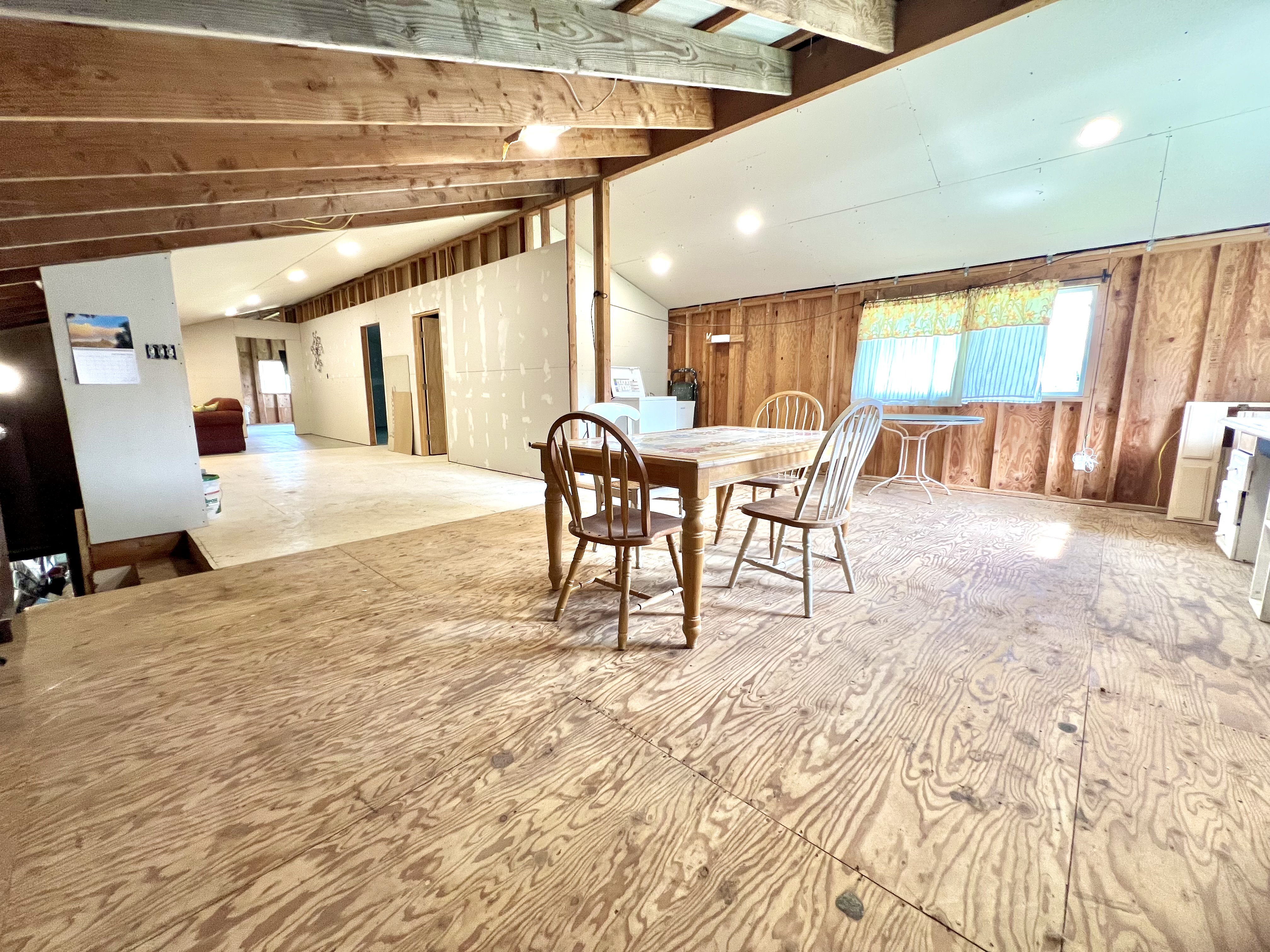 18-4327 North Peck Road Mountain View, HI 96771 - Photo 30 of 30 a dining room with furniture and a floor to ceiling window