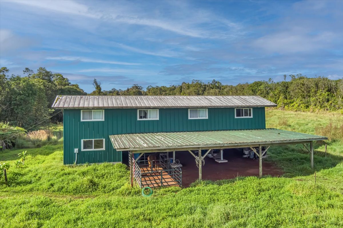 18-4327 North Peck Road Mountain View, HI 96771 - Photo 6 of 30 an aerial view of a house with a garden