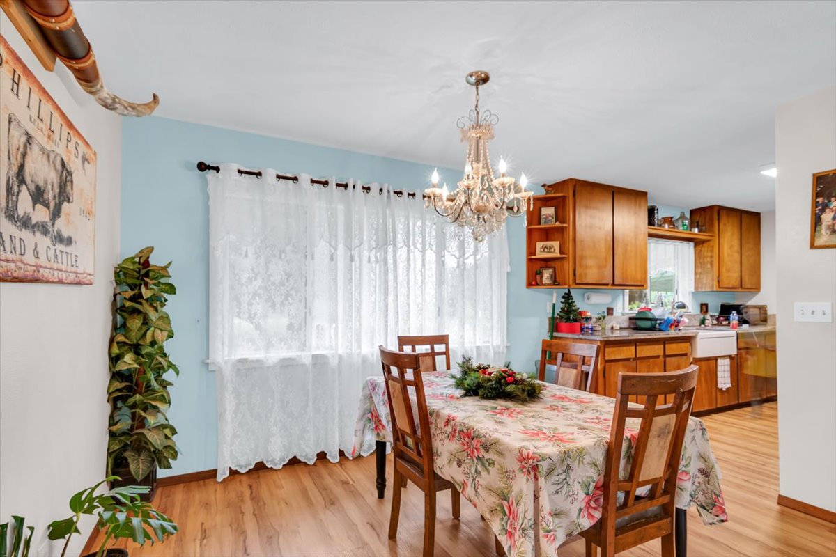 18-4327 North Peck Road Mountain View, HI 96771 - Photo 7 of 26 a view of a dining room with furniture window and wooden floor