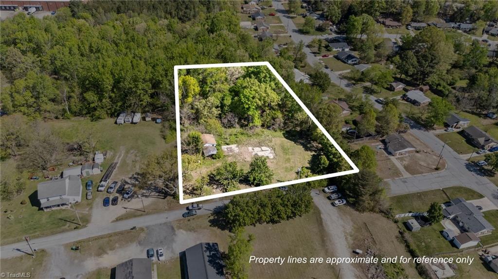 1011 Gaines Avenue High Point, NC 27263 - Photo 1 of 10 Spacious 2.32-acre homesite