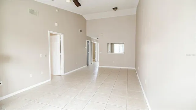 a view of an empty room with windows