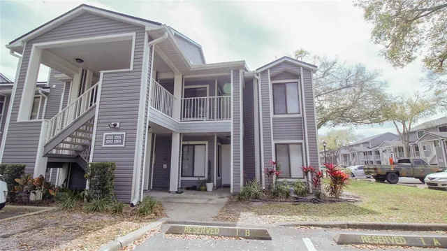 a front view of a residential apartment building with a yard