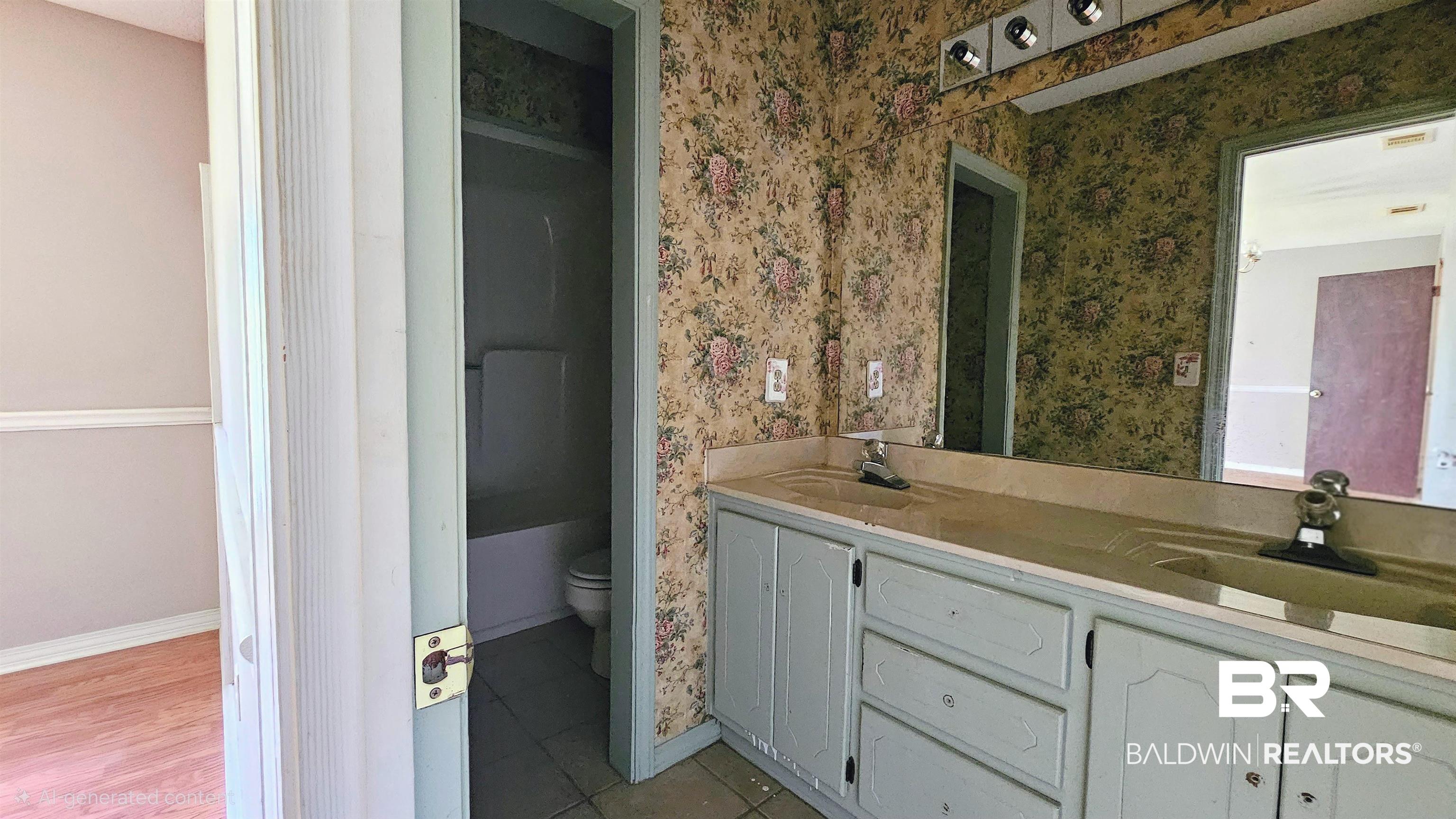 18824 Highway 41 Brewton, AL 36426 - Photo 36 of 40 Bathroom featuring a double vanity with integrated sinks, a large wall-mounted mirror, and a tub/shower combination