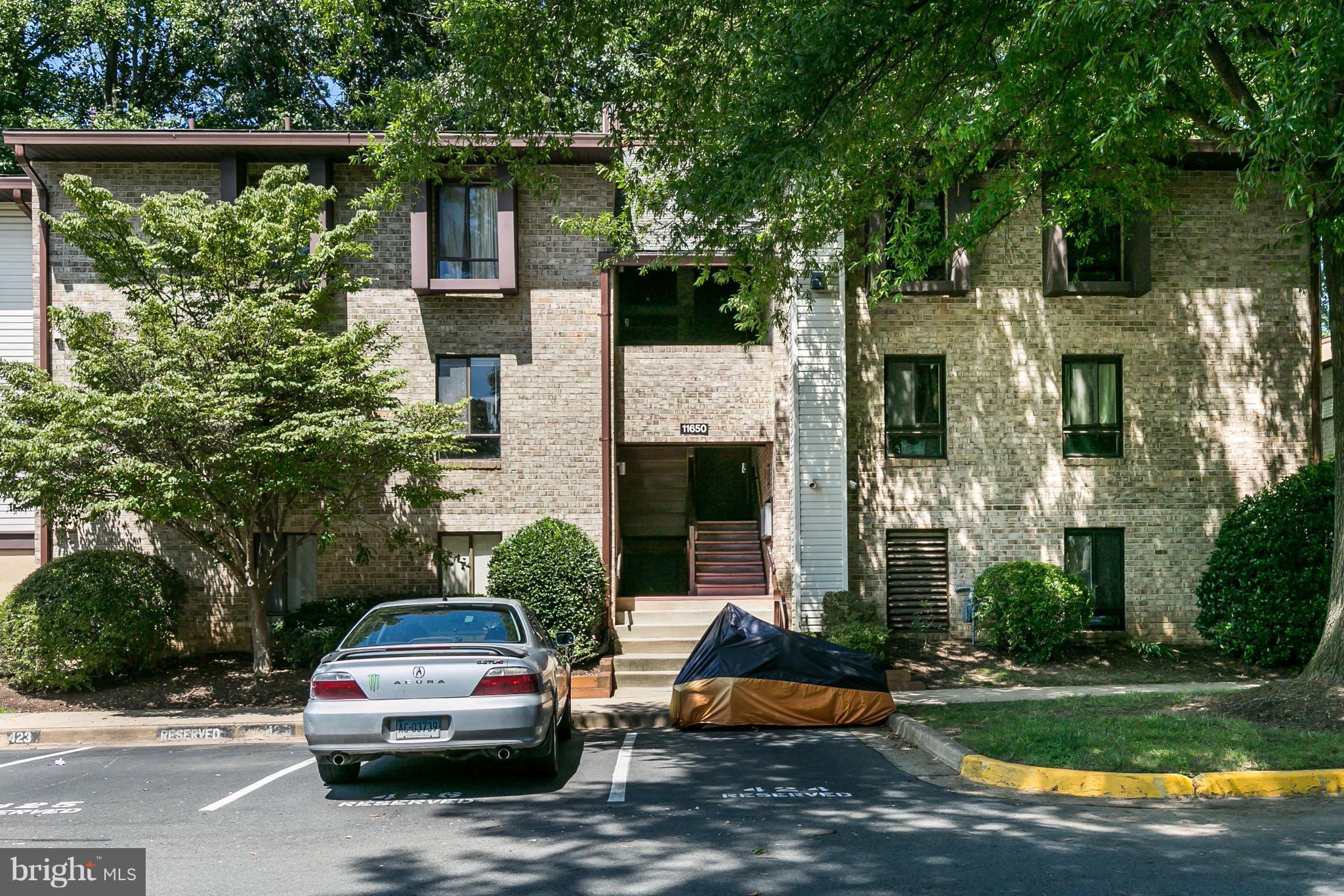 11650 Stoneview Square, Unit 11C Reston, VA 20191 - Photo 1 of 26 a car parked in front of a house