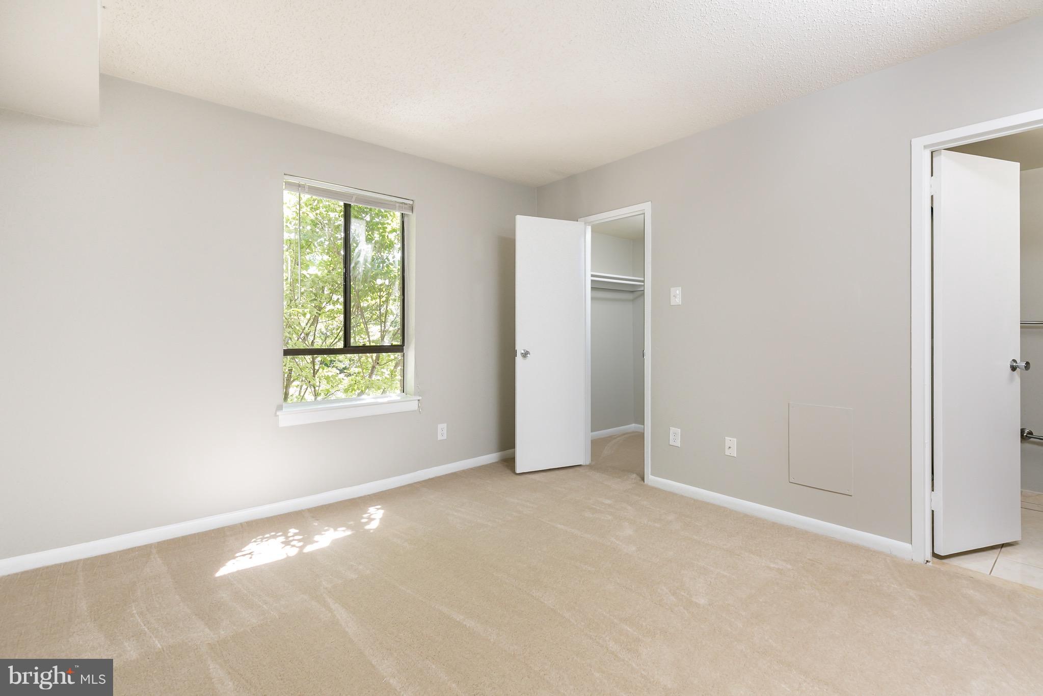 11650 Stoneview Square, Unit 11C Reston, VA 20191 - Photo 13 of 26 a view of an empty room with a window