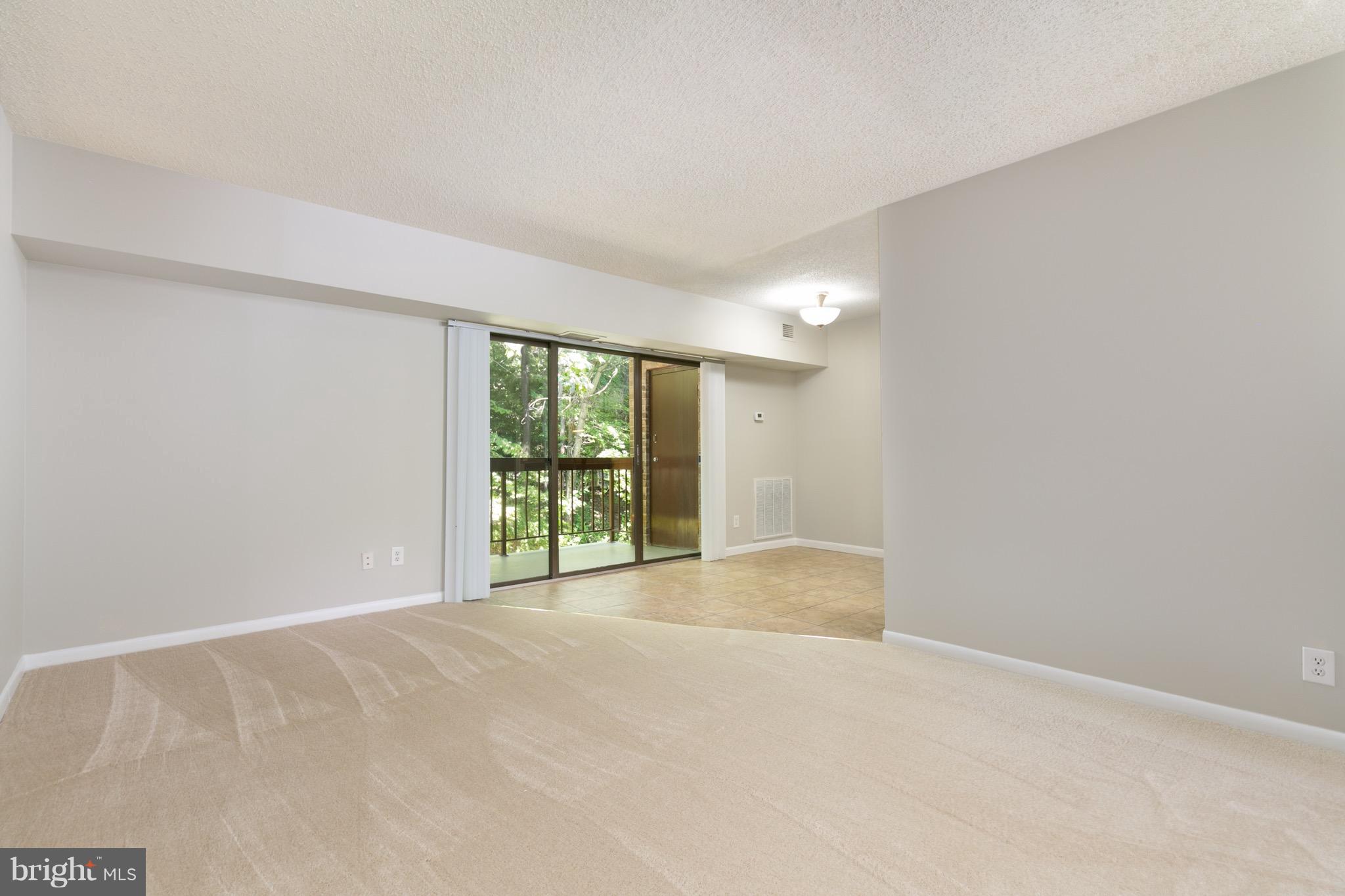 11650 Stoneview Square, Unit 11C Reston, VA 20191 - Photo 18 of 26 a view of an empty room with a window