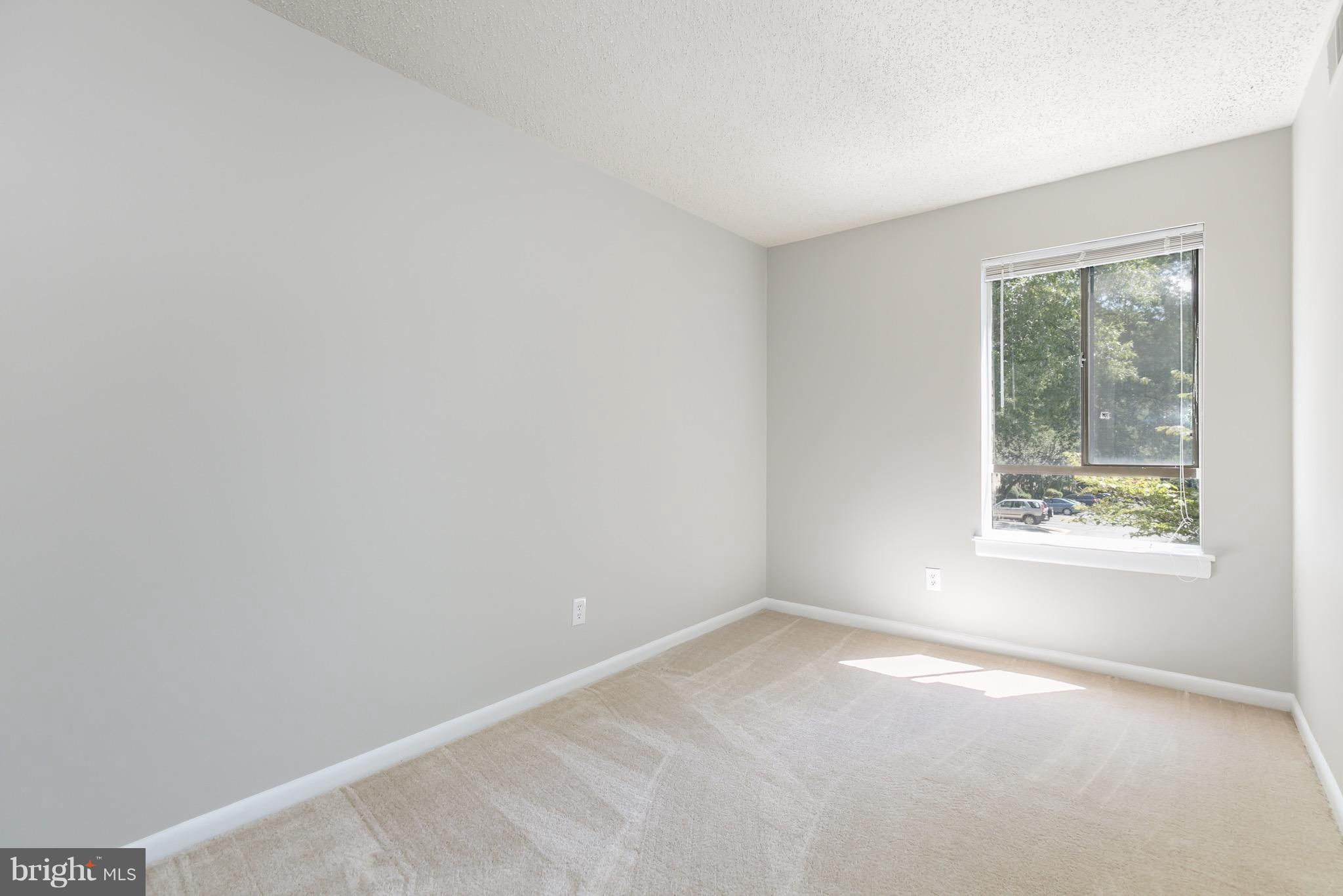 11650 Stoneview Square, Unit 11C Reston, VA 20191 - Photo 6 of 26 an empty room with a window