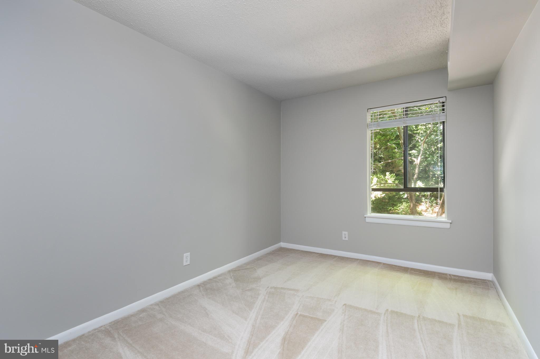 11650 Stoneview Square, Unit 11C Reston, VA 20191 - Photo 8 of 26 an empty room with a window