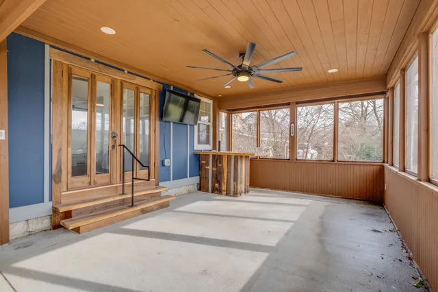 a view of an empty room with a window