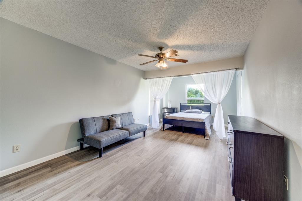 4440 Dripping Spring Road Sherman, TX 75090 - Photo 14 of 39 a living room with furniture and a wooden floor