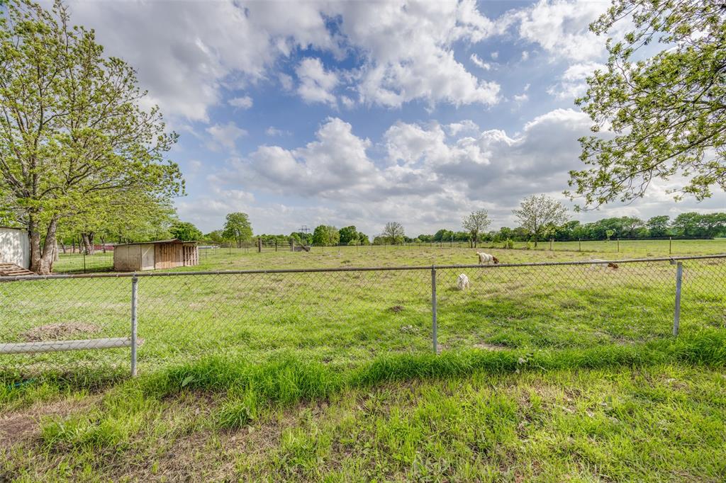 4440 Dripping Spring Road Sherman, TX 75090 - Photo 22 of 39 a view of a field with a tree