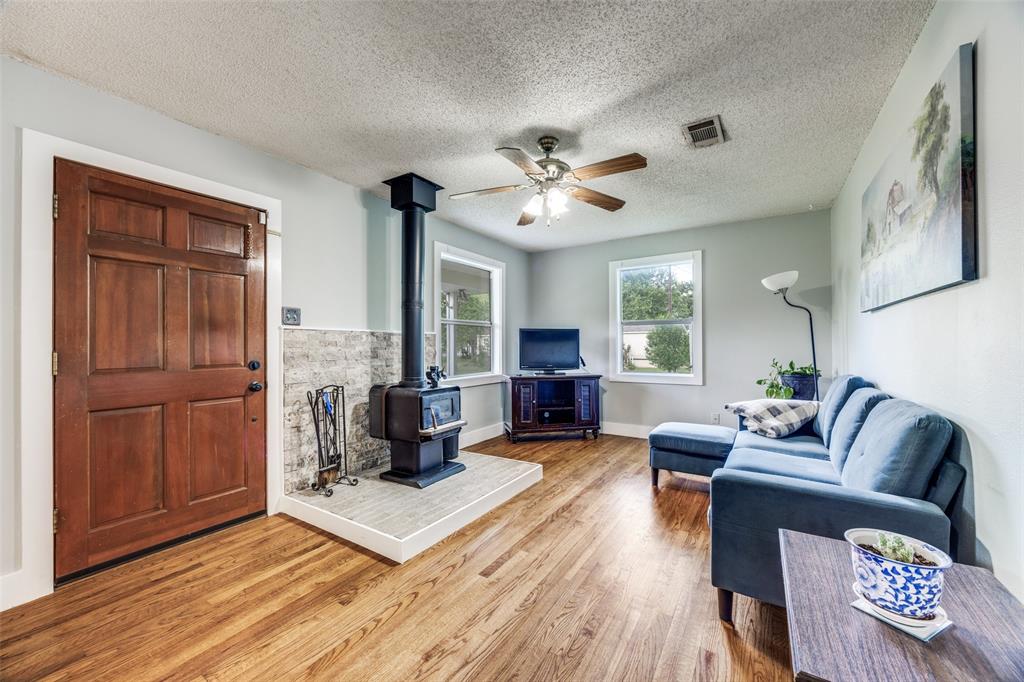 4440 Dripping Spring Road Sherman, TX 75090 - Photo 3 of 39 a living room with furniture and wooden floor