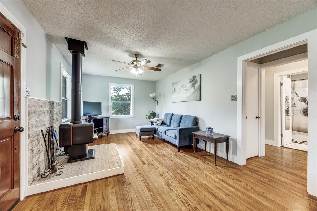 4440 Dripping Spring Road Sherman, TX 75090 - Photo 4 of 39 a living room with furniture and wooden floor