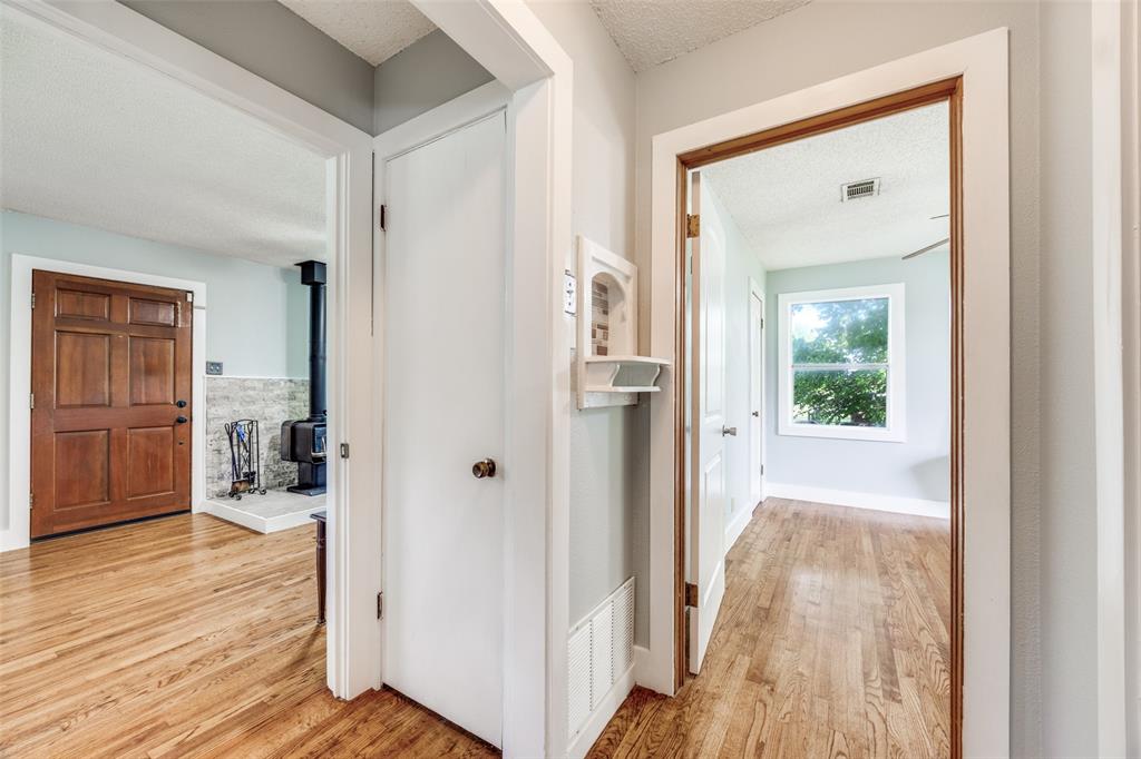 4440 Dripping Spring Road Sherman, TX 75090 - Photo 7 of 39 a view of a hallway with wooden floor and closet area
