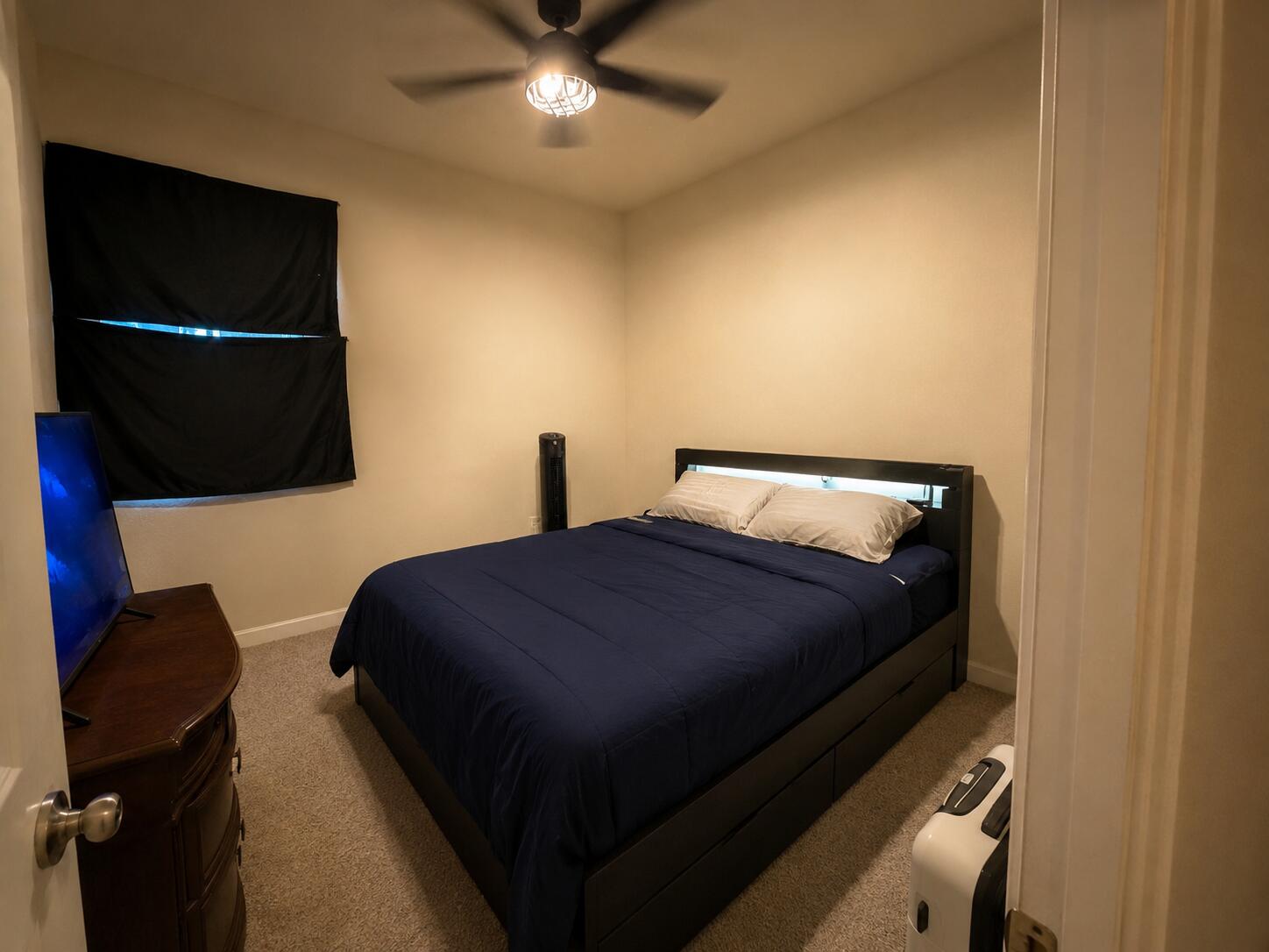 10463 Southwest 228th Terrace Miami, FL 33190 - Photo 6 of 8 a bedroom with a bed and a chandelier