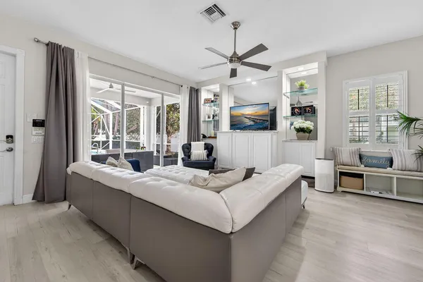a living room with furniture and a large window