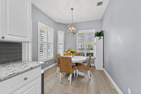 a view of a dining room with furniture window and outside view