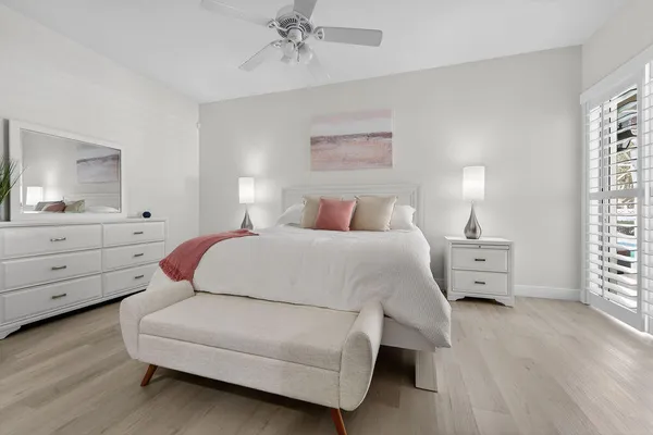 a bed room with a bed and a window