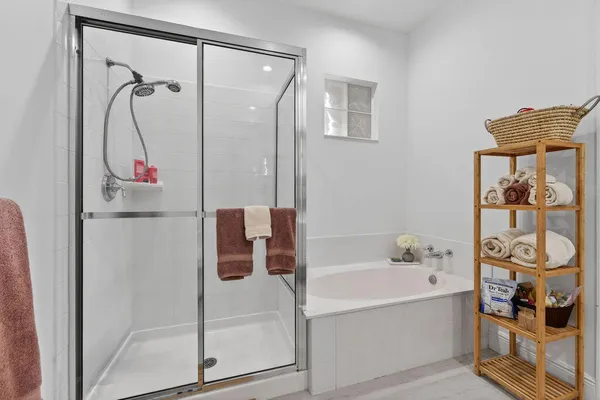 a bathroom with a bathtub and a shower